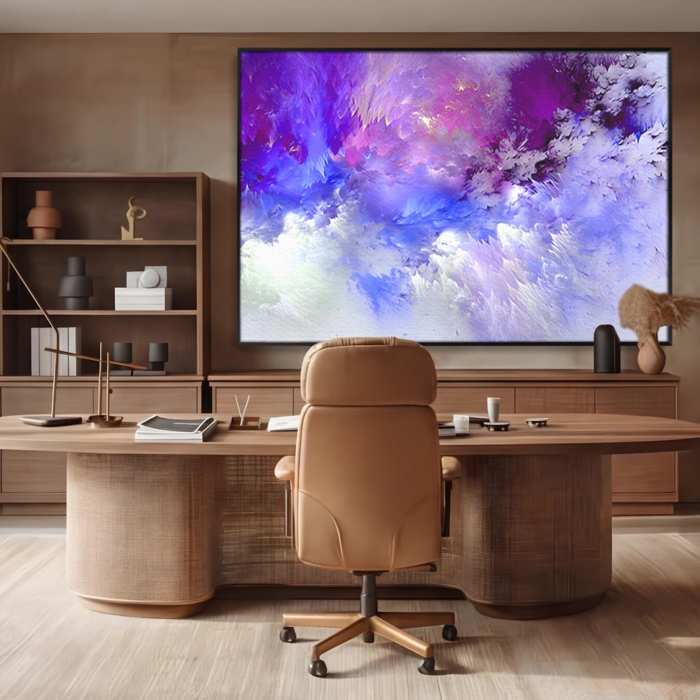 Tablou canvas cu pictura abstracta cu nori mov si albastri, in rama de aluminiu negru, pe perete intr-un birou